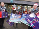 Staff at the Co-op shop in Orrell, from left, Tom Fitchett, Melissa Guy, Sue Allan and Sharon Perree, with some of the many gifts, toys and food packages they have given to families of children at Dean Trust schools