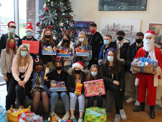 St John Rigby college students with their gifts