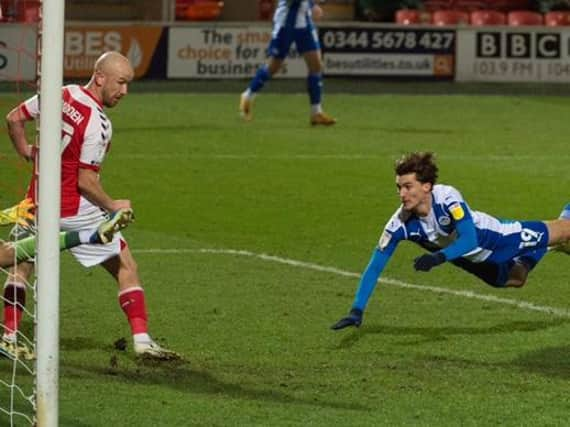 Ollie Crankshaw heads home the Latics equaliser at Fleetwood