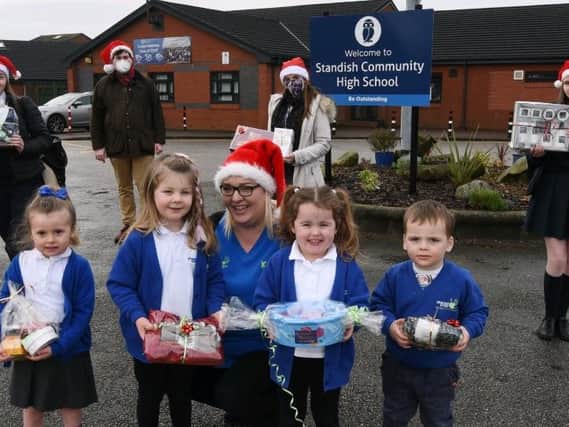 Katie Wallington, front centre, manager at Standish Under 5’s Nursery and Pre-School pictured withyoungsters, pupils from Standish High School, Coun Adam Marsh, back second from left, and Emma Hall staff member from Standish Hall.