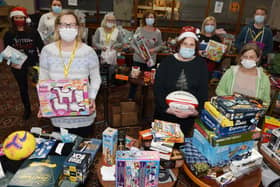 Volunteers at Daffodils Dreams with gifts and toys donated for children in Wigan at Christmas
