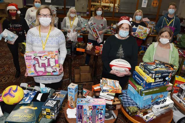 Volunteers at Daffodils Dreams with gifts and toys donated for children in Wigan at Christmas