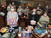Volunteers at Daffodils Dreams with gifts and toys donated for children in Wigan at Christmas