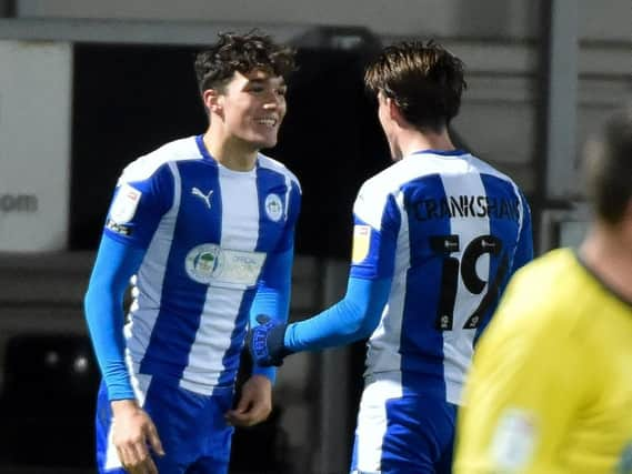 Kyle Joseph takes the congratulations from Ollie Crankshaw after scoring one of his hat-trick at Burton