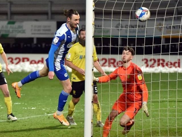 Will Keane heads home the winner at Burton