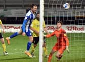Will Keane heads home the winner at Burton