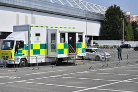 An empty drive-through testing station in the car park at Ashton Gate Stadium in Bristol, where one of seven mass vaccination centres will open next week