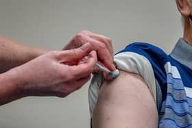 A Covid-19 vaccine being given