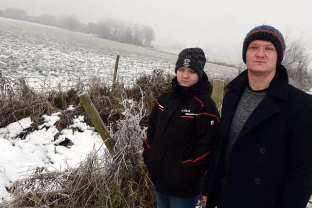 Danny Fletcher and son Harvey, 12, pictured on green belt land off Bolton Road, Stubshaw Cross