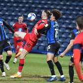 Will Keane in the act of scoring what was almost the winning goal for Latics
