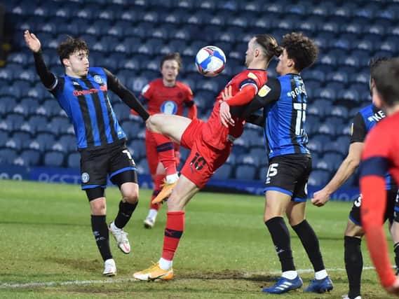 Will Keane in the act of scoring what was almost the winning goal for Latics