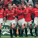 United celebrate Eric Cantona's late FA Cup final winner in 1996