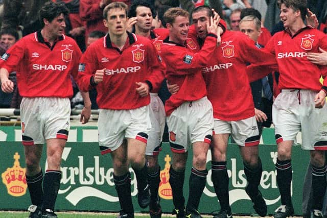 United celebrate Eric Cantona's late FA Cup final winner in 1996