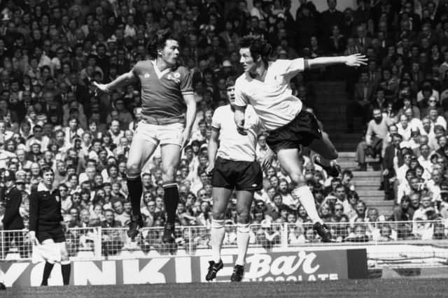 Manchester United scorer Stuart Pearson battles with Liverpool's Jimmy Case in the 1977 final