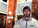 Dave Harrison outside his home