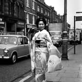 A visitor from Japan turned heads along Market Street in Wigan, promoting Nikon cameras in 1971