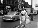 A visitor from Japan turned heads along Market Street in Wigan, promoting Nikon cameras in 1971