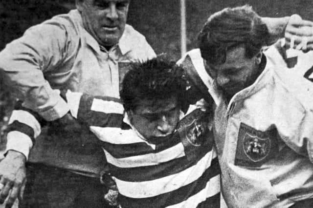 Dave Bolton is helped off the Wembley pitch