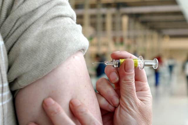 A Covid-19 vaccine dose being given