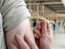 A Covid-19 vaccine dose being given