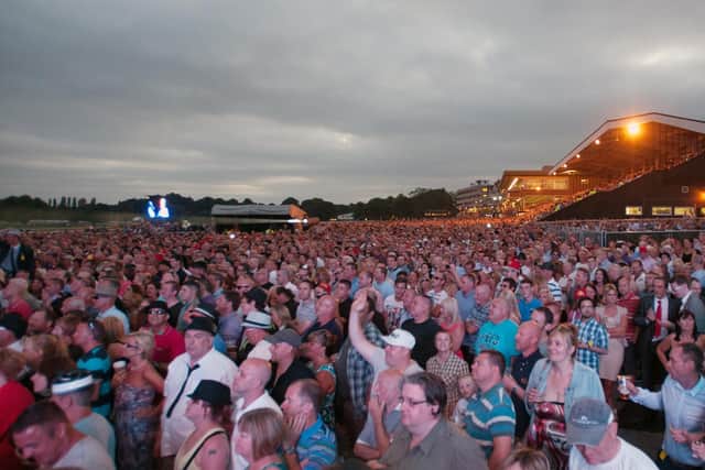 A huge crowd at Haydock Park watching Madness