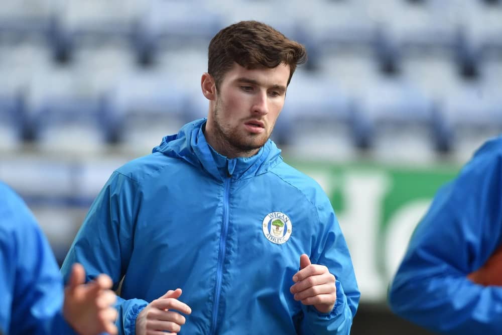 Corey Whelan warming up before his Latics debut