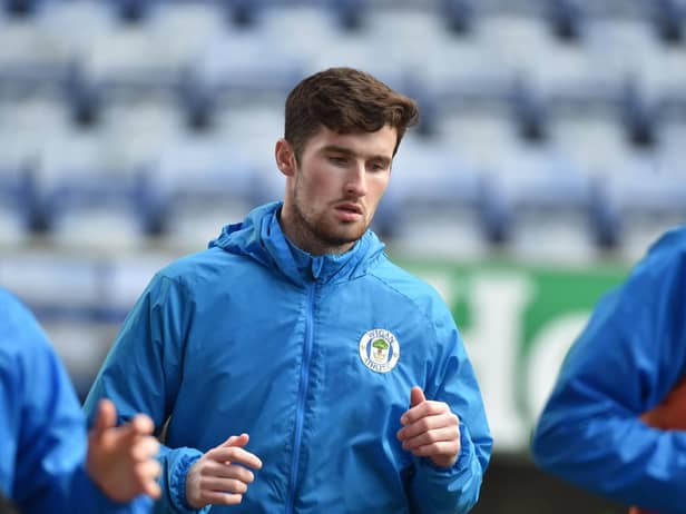 Corey Whelan warming up before his Latics debut