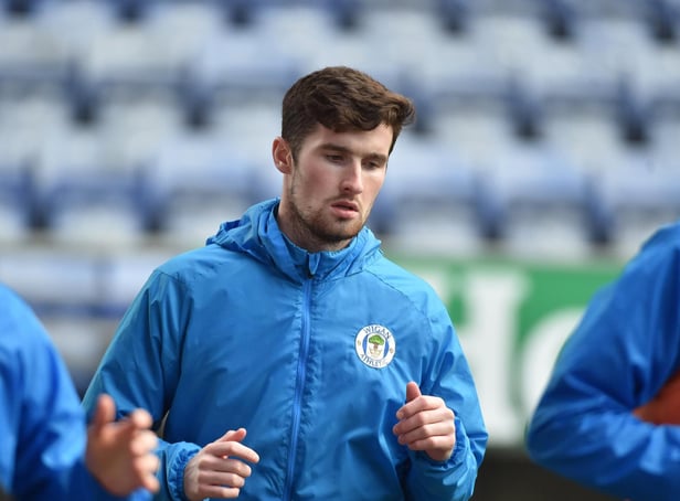 Corey Whelan warming up before his Latics debut