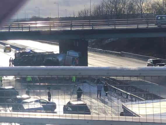 The damaged tanker underneath the bridge