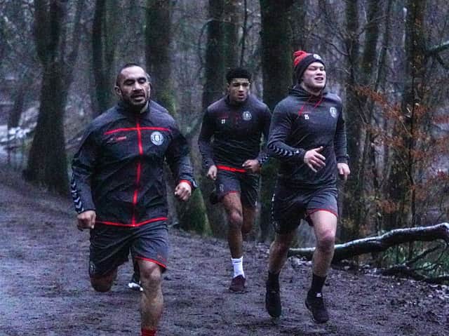 Morgan Smithies (right) running in Haigh Hall