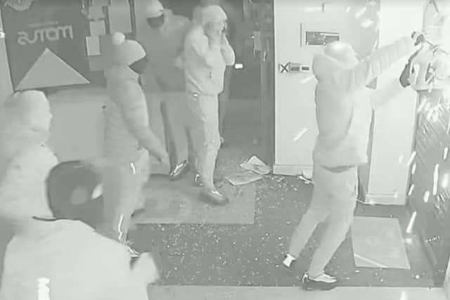 CCTV images show the robbery in progress