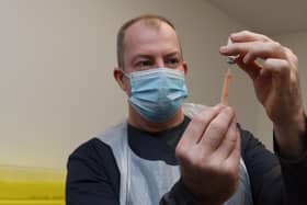 A Covid-19 vaccine dose being prepared