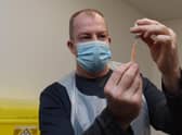 A Covid-19 vaccine dose being prepared