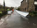 Temporary flood barriers at Ribchester, put in place by the Environment Agency during Storm Christoph in January 2021