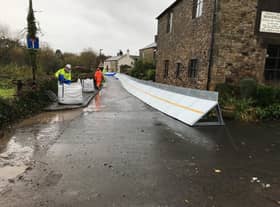 Temporary flood barriers at Ribchester, put in place by the Environment Agency during Storm Christoph in January 2021