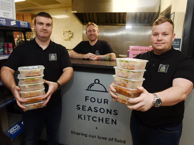 Darryl Latham and Ben Anglesea, from Eat Drink Wigan, with Ben Melling, centre, owner of Four Seasons Kitchen