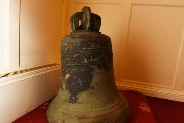 The historic bell back at the church