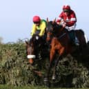 Davy Russell riding Tiger Roll clears the final fence as he races to victory in the 2019 Randox Health Grand National at Aintree