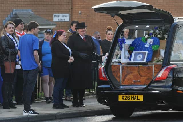 Mourners wore blue or sports kits to pay their respects