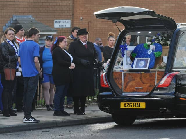 Mourners wore blue or sports kits to pay their respects