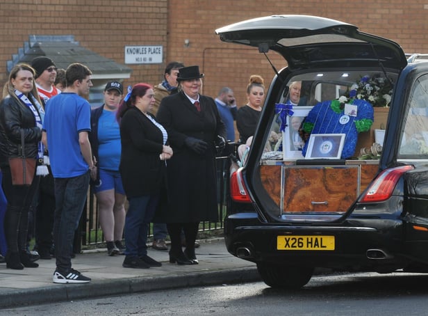 Mourners wore blue or sports kits to pay their respects