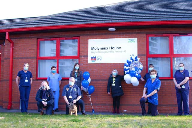 From Left – Richard Mundon, director of strategy and planning and lead director for the caccine programme at the trust, Centre - Melissa Walsh (10,000th vaccination) and the trust vaccination programme team outside Armed Forces HQ (vaccination site).