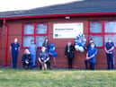 From Left – Richard Mundon, director of strategy and planning and lead director for the caccine programme at the trust, Centre - Melissa Walsh (10,000th vaccination) and the trust vaccination programme team outside Armed Forces HQ (vaccination site).