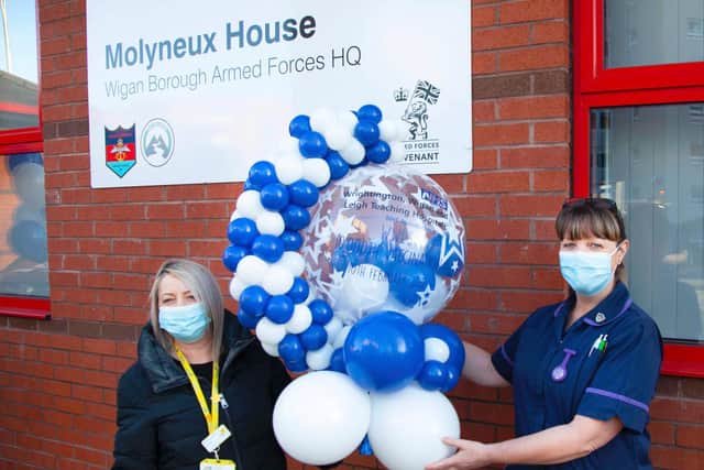 Melissa Walsh and Angela Brookes, trust occupational health clinical manager with the 10,000th balloon
