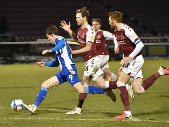 Callum Lang shoots for goal against Northampton