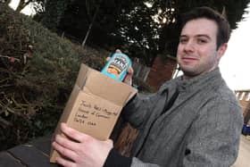 Wigan Today reporter Liam Soutar boxes up some Heinz Baked Beans for Jacob Rees-Mogg