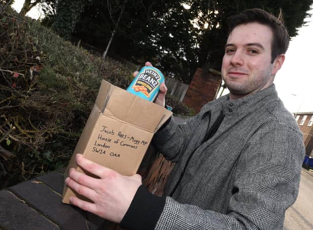Wigan Today reporter Liam Soutar boxes up some Heinz Baked Beans for Jacob Rees-Mogg