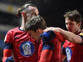 Callum Lang takes the congratulations after scoring at Oxford