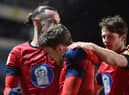 Callum Lang takes the congratulations after scoring at Oxford