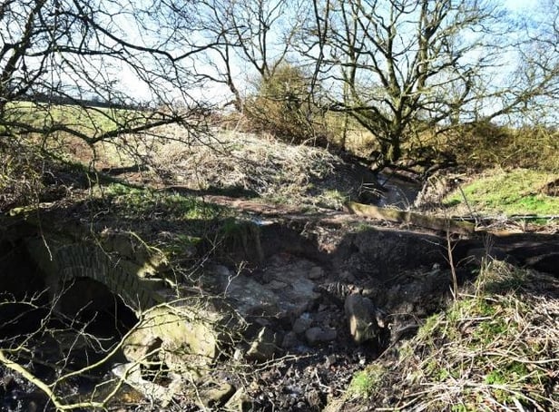 The path and bridge over Hic Bibi brook have been badly eroded by heavy rainfall